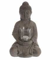 Boeddha met waxine licht houder trend