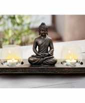 Zittende boeddha waxinelichthouder op plank zwart 32 cm trend